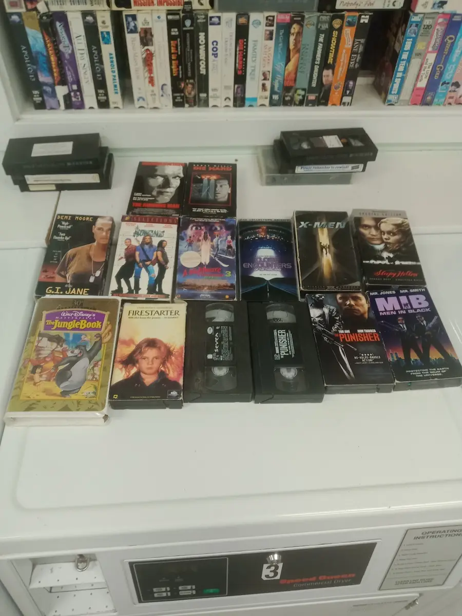 Shelf of movies in the Valley Country Store laundromat